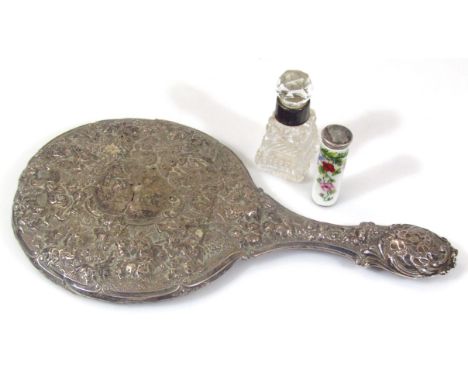 A heavily cast scrap silver hand mirror, repoussé decorated, with scrolls and flower heads, 28cm wide, a silver and enamel ja