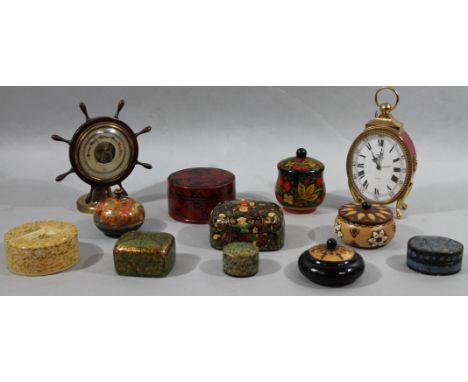 A 20thC brass and wooden ship's wheel table top barometer, with 11cm dia. dial, various paper maché style and other boxes, 15