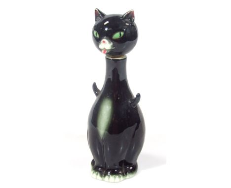 A 1950s Goebel Hummel figure of a standing cat, in black with green eyes, marked BBE, 25cm high