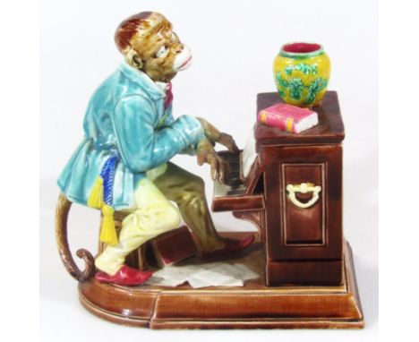 A late 19thC Sarreguemines majolica monkey and piano group, with cover, polychrome decorated in predominantly turquoise, brow