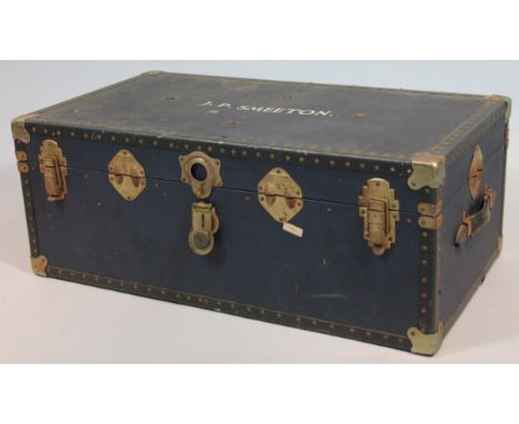 A 20thC pressed blue leather travel trunk, with metal and studded outline, with leather handles and part fitted interior, nam