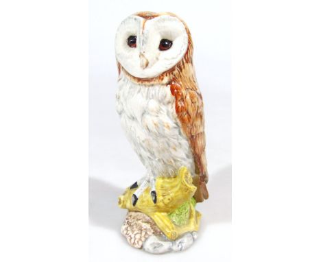 A Beswick beneagles barn owl pottery whisky decanter, with contents, printed marks and label beneath, 18cm high.