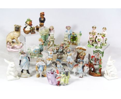 Various Continental porcelain figures, to include cherub ornaments, probably early 20thC, each holding floral bouquets, polyc
