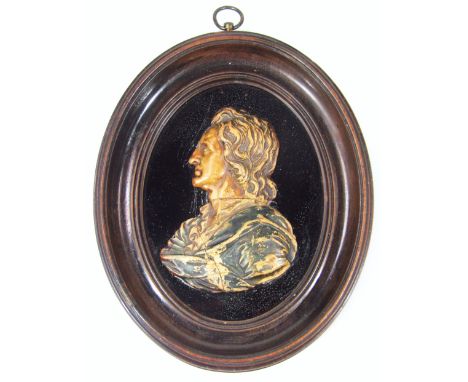 A 19thC wax profile portrait miniature, of a gentleman quarter side profile in Cromwellian dress, on a glass back in polished