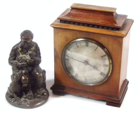 An early to mid 20thC mahogany cased mantel clock, in domed case with 9cm dia. Roman numeric dial, fronting a keywind movemen