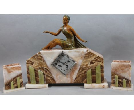 A 20thC Art Deco design marble and spelter mantel clock, the 14cm wide diamond Arabic dial, signed E. Baldouy St. Grons, surm
