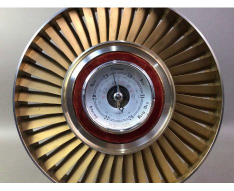 ART DECO STYLE BAROMETER the barometer surrounded by a novelty jet engine turbine, mounted on a wooden base32cm high 
