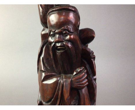 CHINESE ROOT WOOD LAMP 20TH CENTURY the lamp in the form of a figure, with bone teeth and eyes62cm high