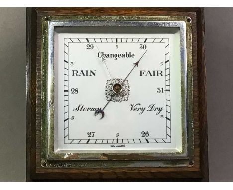 ANEROID BAROMETER AND A BRASS TEA KETTLE barometer with thermometer, contained in an oak case and a Victorian brass tea kettl