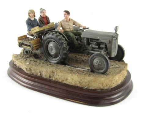 A Border Fine Arts figure group 'Maris Crop', depicting figure on tractor and two potato pickers, on a wooden base, 15cm high