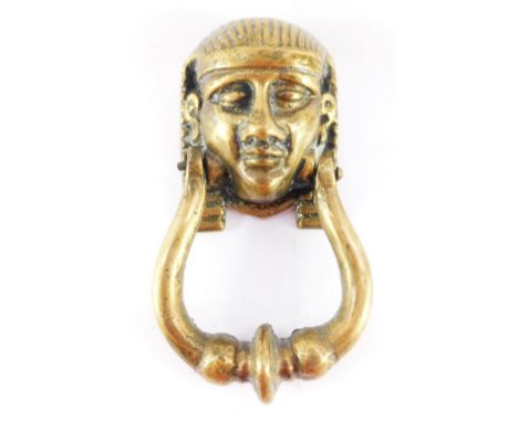 A Victorian brass door knocker, cast as an Egyptian Sphinx's head, 21cm high.