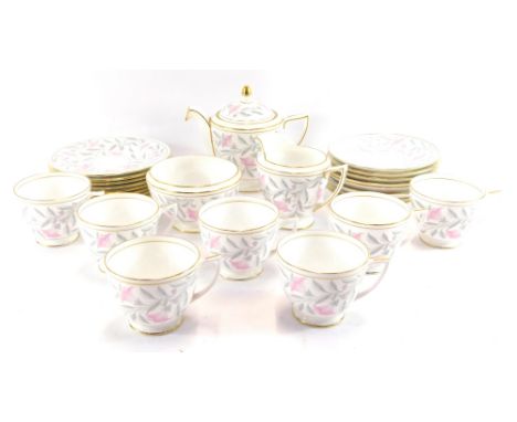 A Minton porcelain tea service in the Petunia pattern, comprising teapot, milk jug, sugar bowl, eight tea plates, seven tea c