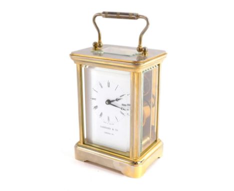 A Garrard and Co of London brass cased carriage clock, rectangular enamel dial bearing Roman numerals, single barrel movement