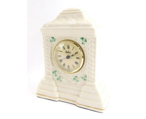A Belleek Cashel porcelain mantel clock, decorated in the Shamrock pattern, the dial marked Belleek, 20cm high.