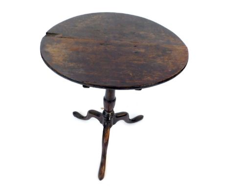 A 19thC oak tripod table, the circular top on a turned column and  tripod base, 70cm high, 56cm diameter. 