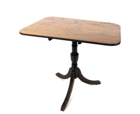 An early 19thC mahogany table, the rectangular top with rounded corners on a turned support with reeded out splayed tripod le