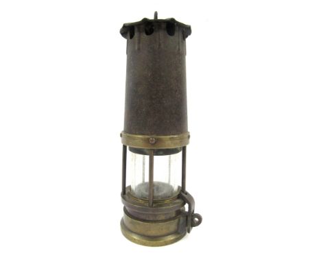 A British Miner's brass lamp, 24cm high.