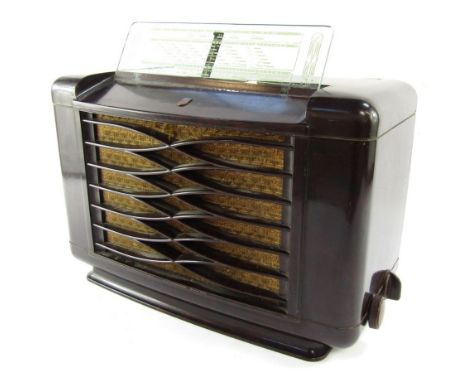 A Phillips Bakelite vintage radio, in brown, with Phillips enamel badge, and lift up plastic panelLed visor, 35cm high, 41cm 