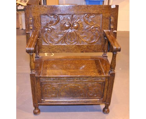 GREEN MAN MONKS BENCH. Antique monks bench heavily carved with Green Man design
