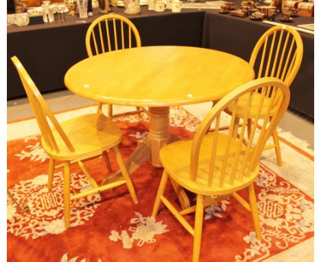 DINING TABLE AND CHAIRS. Beech block circular kitchen table with four stick back dining chairs 