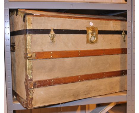 TRAVEL TRUNK. Large dome topped metal and wood bound travel trunk