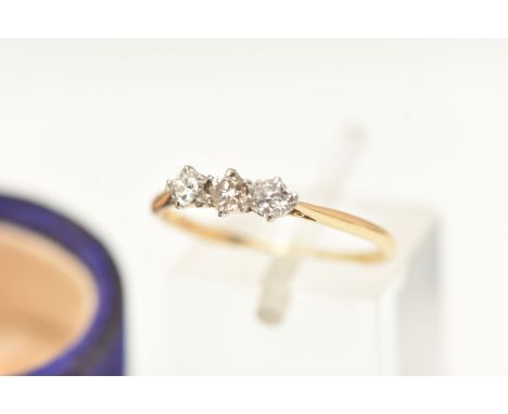 A YELLOW METAL THREE STONE DIAMOND RING, set with three old cut diamonds, each approximately 0.10ct, estimated total diamond 