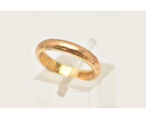 A 22CT GOLD BAND RING, worn textured band, approximate band width 3.4mm, engraved to the inner band 'Eternal Love', hallmarke