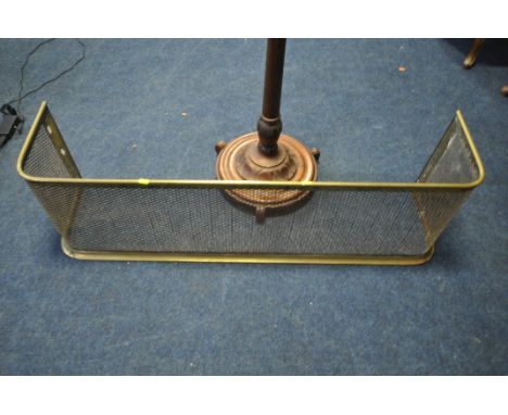 A BRASS AND MESH FENDER, length 119cm, along with a standard lamp, condition report: the lamp has no cable, both with general