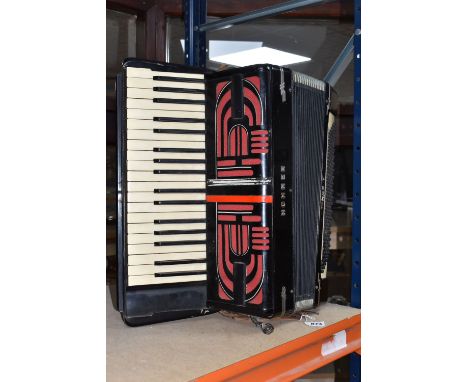 A HOHNER TANGO V ACCORDION, serial no. 683499, straps are in worn condition but still sturdy, bellows don't appear to have an