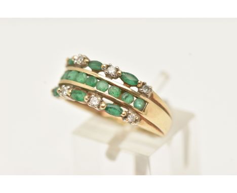 A 9CT GOLD EMERALD AND DIAMOND RING, designed as three rows of marquise and circular cut emeralds, and eight small round bril
