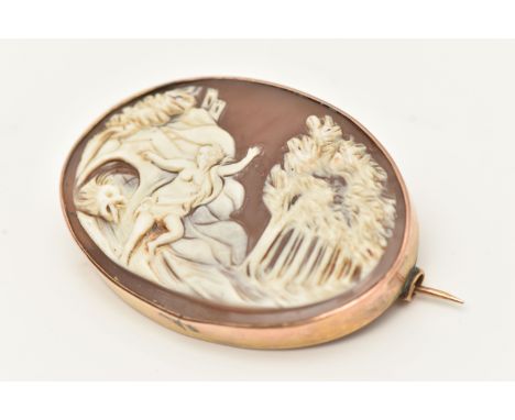A YELLOW METAL CAMEO BROOCH, of an oval form, depicting a mythical scene, collet set within a yellow metal, stamped 9ct, fitt