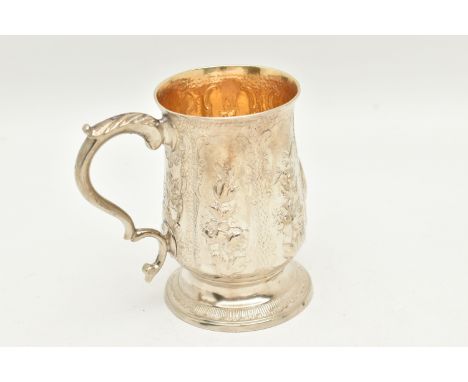 A GEORGE III SILVER CHRISTENING MUG, by Peter and Ann Bateman, S scroll handle, later repoussé decorated with floral panels a