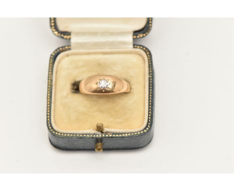 A YELLOW METAL STAR SET DIAMOND RING, old cut diamond, estimated diamond weight 0.15ct, to a polished unmarked band, ring siz