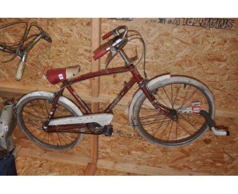 A VINTAGE TRIUMPH RODEO CHILDS BIKE with 15in frame, what appears to be original paint (some rust and flaking paint)