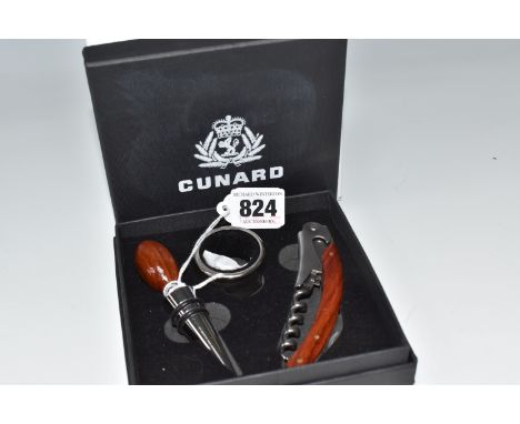 A BOXED AVENUE 'CUNARD' DRINKS SET, comprising bottle stopper, collar/drip stopper and corkscrew knife in a fitted presentati