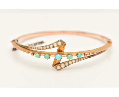 A VICTORIAN ROSE METAL TURQUOISE AND PEARL BANGLE, set with five graduated turquoise cabochons, each in a claw setting, appli