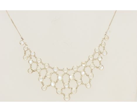 A MODERN SILVER MOONSTONE FESTOON NECKLACE, set with circular moonstone cabochons, fitted to a fine curb link chain with spri