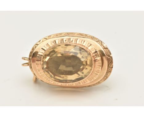 A 9CT GOLD CITRINE BROOCH/PENDANT, oval form set with an oval cut Citrine, measuring approximately 20.9mm x 15.7mm x 9.9mm, m