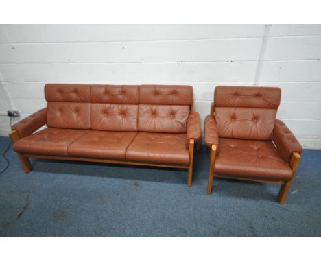 A BROWN LEATHER TWO PIECE LOUNGE SUITE, comprising a three seater sofa, length 203cm x depth 89cm x height 82cm, and an armch