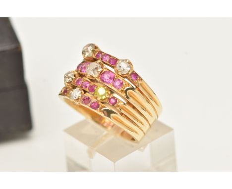 A MID CENTURY RUBY AND DIAMOND RING, a white metal retro design ring set with one oval cut, two circular cut and thirteen squ