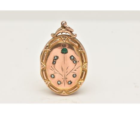 A 9CT GOLD BACK AND FRONT OVAL LOCKET, with a floral pattern set with split pearls and a single circular cut emerald, fitted 
