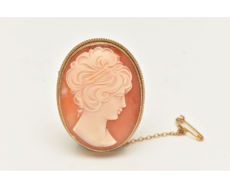 A 9CT GOLD CAMEO BROOCH, of an oval form, carved shell cameo depicting a lady in profile, milgrain collet set to the fine rop