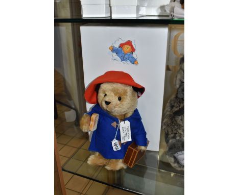 A BOXED STEIFF PADDINGTON BEAR, no 354250, limited edition 3173/5000, jointed, wearing Paddington's trademark blue duffle coa