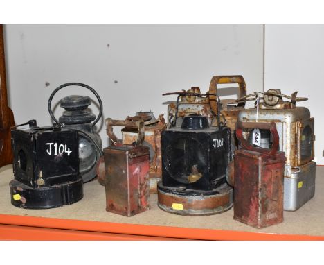 A GROUP OF RAILWAY SIGNAL LAMPS comprising nine vintage railway lamps of assorted form and colour to include two Alkaline Bat