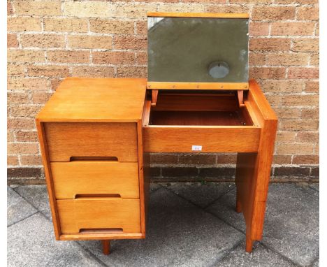 JOHN AND SYLVIA REID FOR STAG:  a 'C' range light oak dressing table, three drawers to pedestal and mirror inset to lift-up s