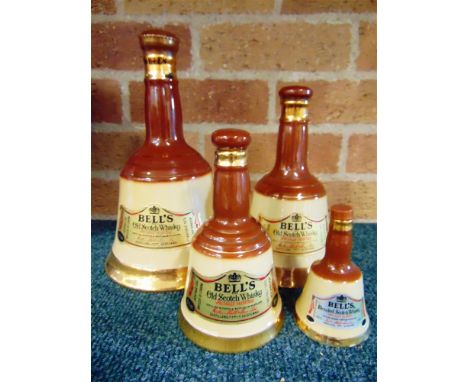 [WHISKY]. FOUR BELL'S WHISKY DECANTERS BY WADE  each unopened (75cl; 37.5cl; 18.9cl; and another, smaller, unspecified).