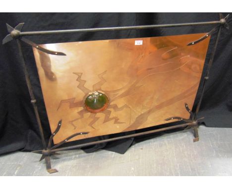 A WROUGHT IRON AND COPPER FIRESCREEN  inset with amber glass roundel, 85cm high 120cm wide