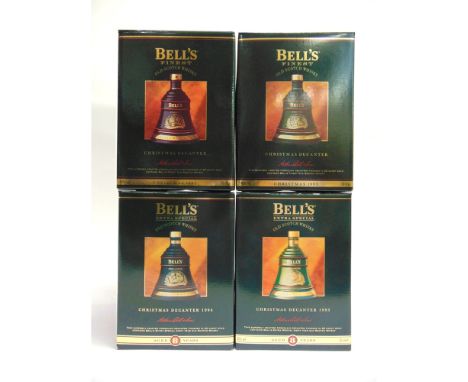 [WHISKY]. FOUR BELL'S CHRISTMAS DECANTERS BY WADE  comprising those for 1992, 1993, 1994 &amp; 1995, each unopened, each boxe