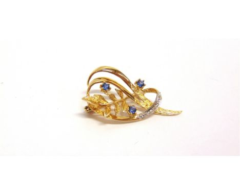 A MODERN 9CT GOLD, SAPPHIRE AND DIAMOND SPRAY BROOCH  in the form of a part textured and polished scrolling and intertwined l