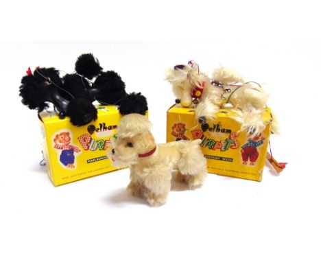 TWO PELHAM PUPPET POODLES  one black and the other white, each boxed; together with a Steiff soft toy poodle, 'Snobby', 14cm 
